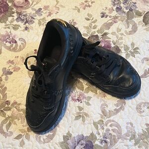 Nike Air Jordan 1 Black Sneakers with Gold Detail